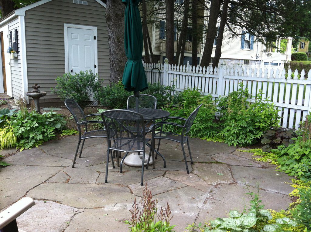 rear bluestone patio with table and chairs